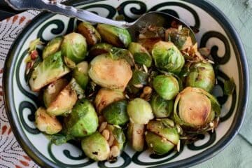 Brussels Sprouts with Almonds served in a pottery bowl.