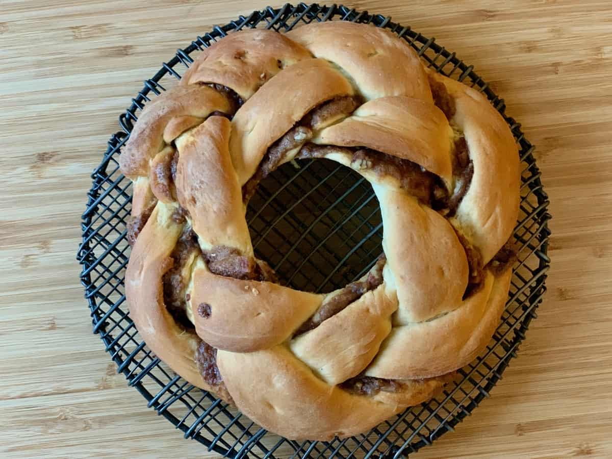 A braided King Cake baked to a golden brown.