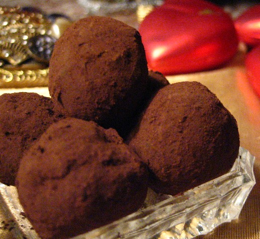 Vanilla Chile Truffles rolled in cocoa powder and arranged in a glass dish