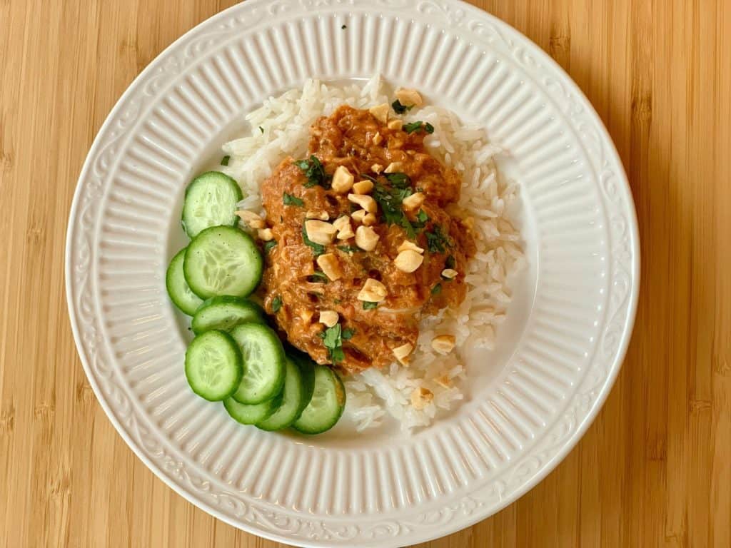 Thai Chicken Thighs, sprinkled with peanuts and cilantro served over Coconut Rice with a side of Cucumber Vinaigrette.