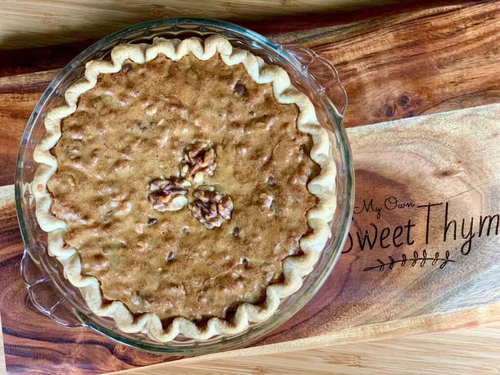 A whole Brownie Pie on a cutting board for My Own Sweet Thyme.