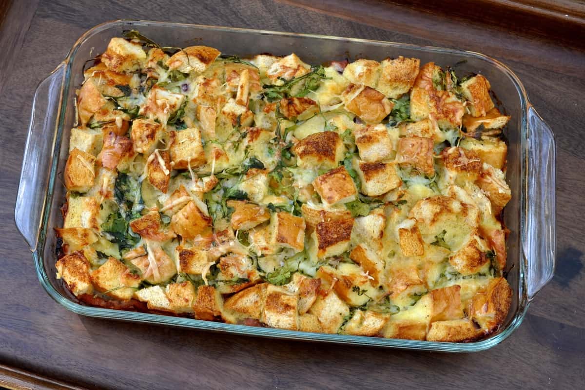 Arugula and Ham Strata served in a 9"x13" casserole dish.