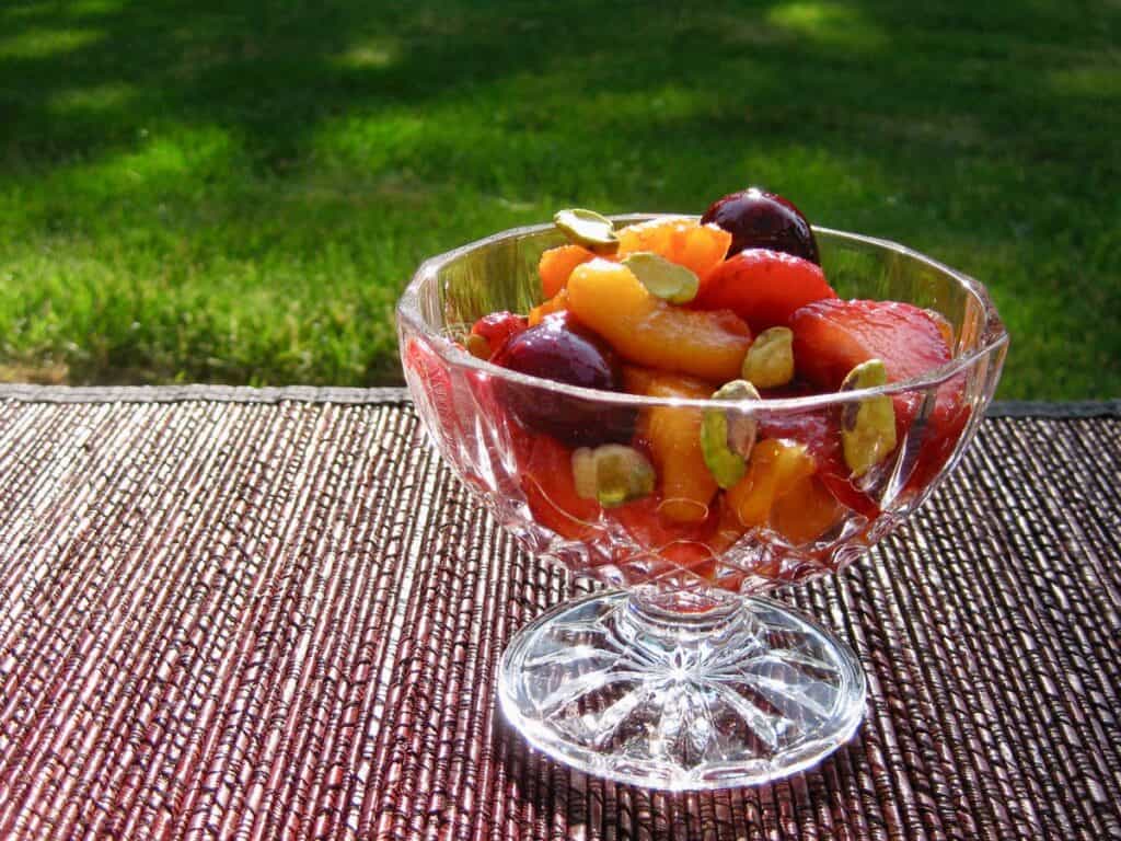 Sangria Fruit Salad served in a cut glass compote.