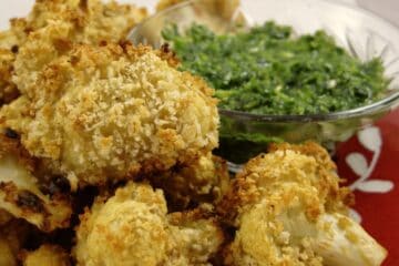 Baked Cauliflower Pakoras are coated with crispy panko crumbs and served with Cilantro Mint Dipping Sauce.