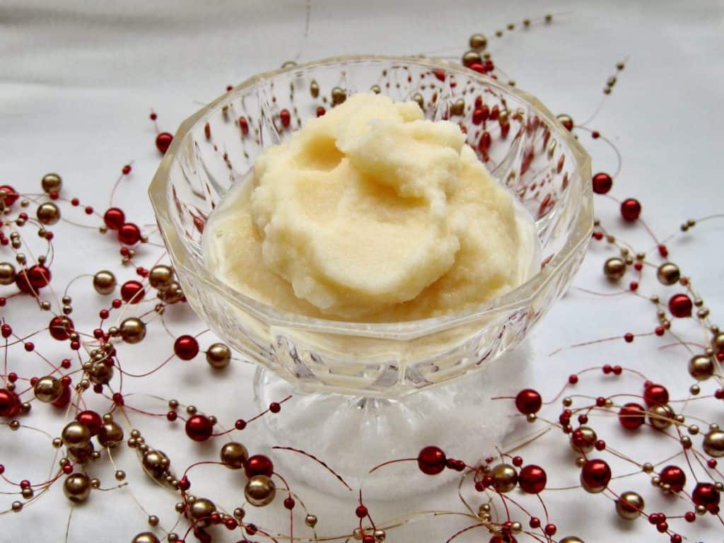 Snow Cream in a glass dish surrounded by a berry garland.