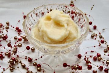Snow Cream in a glass dish surrounded by a berry garland.