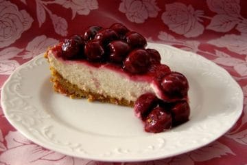 A slice of Cherry Cheese Pie with Morello Cherry Topping.