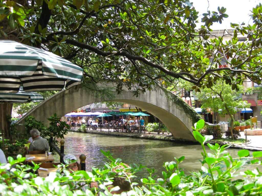 A foot bridge crosses the river at San Antonio's Riverwalk.