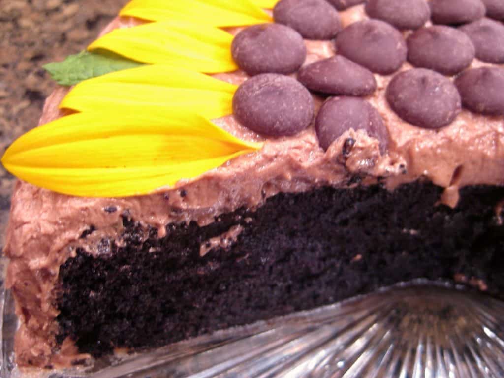 A view inside a Sunflower Chocolate Cake with a slice cut away.