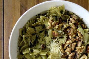 Walnut Pesto Sauce on pasta with walnuts and shredded parmesan.