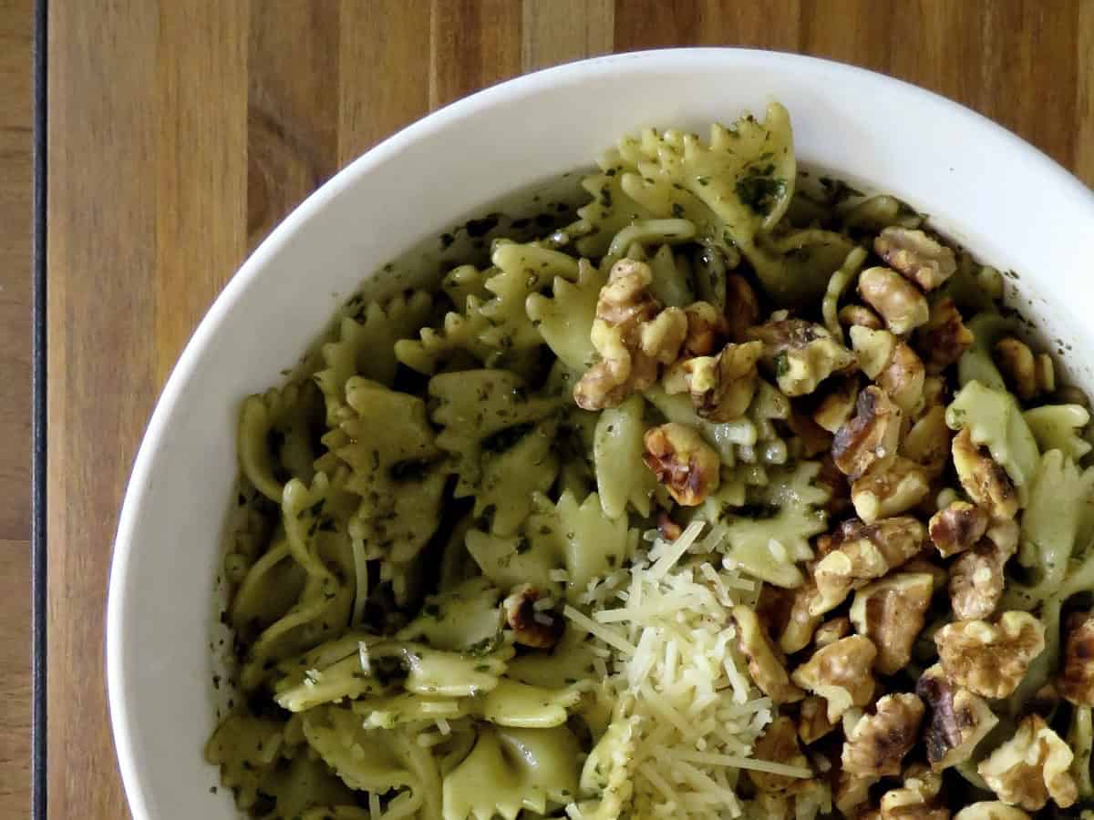 Walnut Pesto Sauce on pasta with walnuts and shredded parmesan.