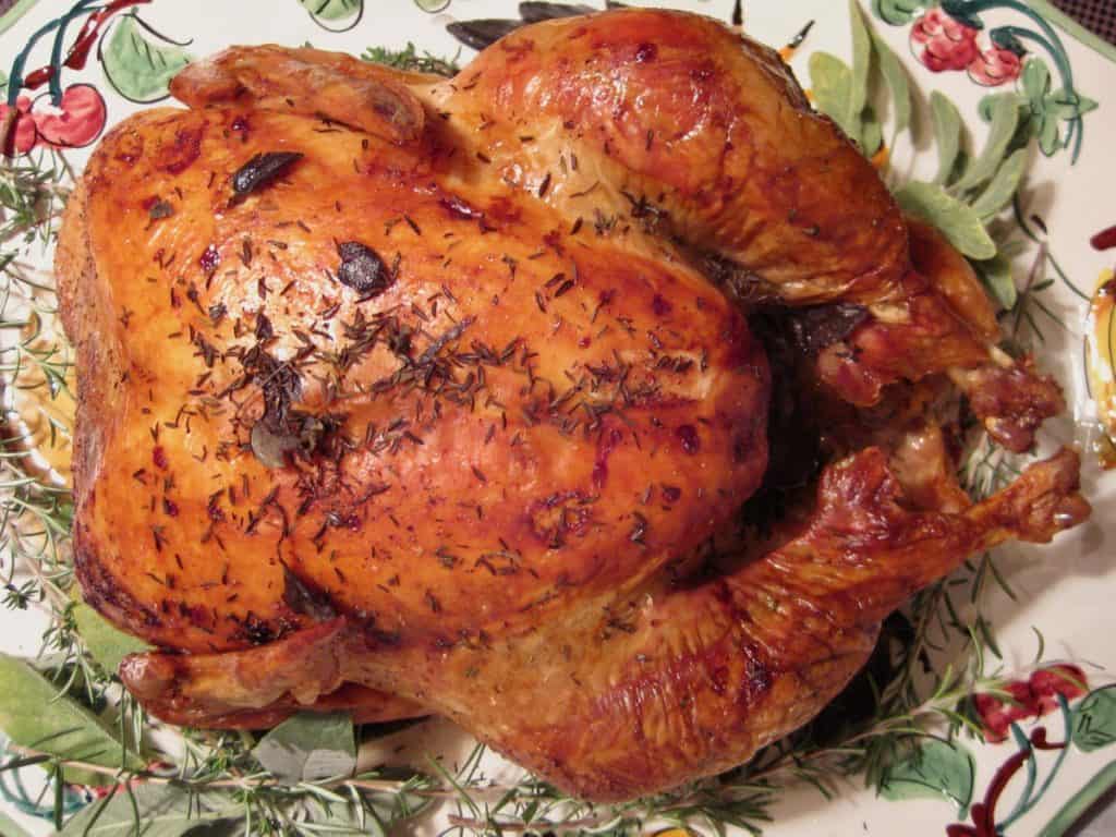 A golden skinned Thanksgiving turkey entree roasted to perfection.