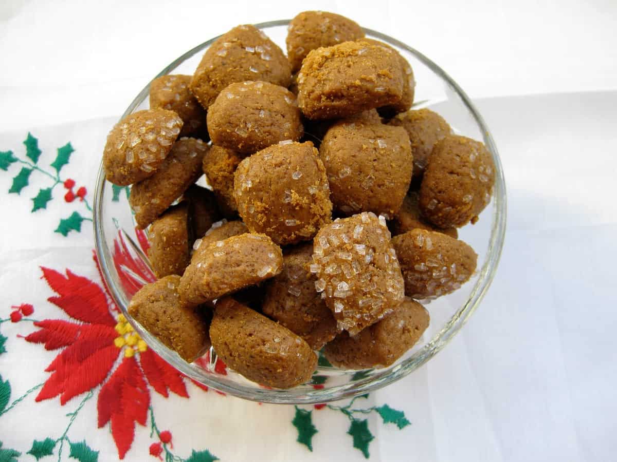 A small glass bowl filled with Peppernuts (Pfeffernuesse), a spicy bite-sized cookie.