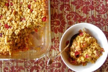 Cranberry Orange Baked Oatmeal scooped from a serving dish into an individual bowl.