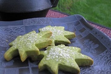 Green Tea Cookies (Matcha Shortbread) served on a square black Japanese plate beside an iron teapot (tetsubin).