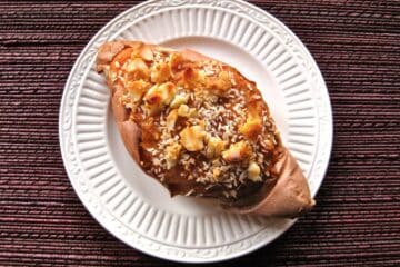 Twice Baked Sweet Potatoes topped with macadamia nuts and shredded coconut.