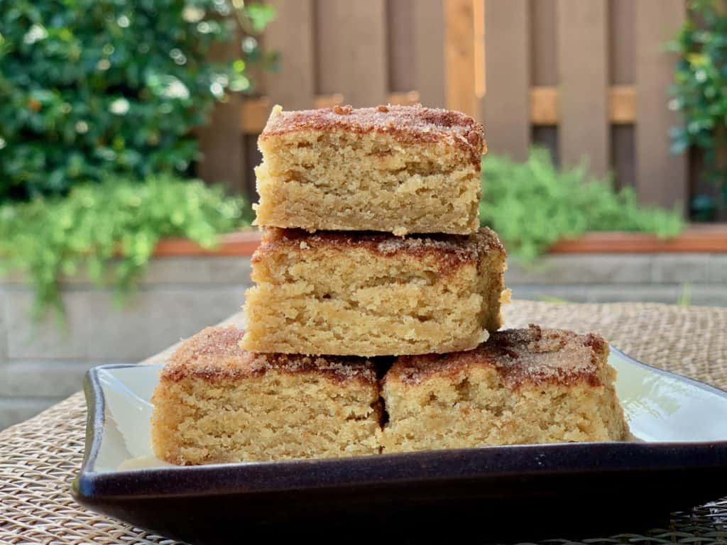 Soft Snickerdoodle Blondies, topped with cinnamon and sugar, look chewy and delicious.