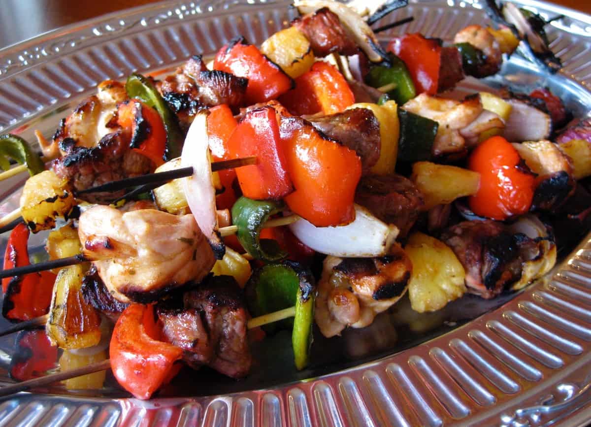 Skewers of Bagheera Jerk Kabobs on a metal platter.