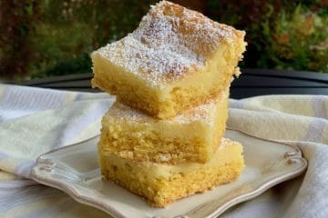 Chess Squares dusted with powdered sugar and stacked on a small plate