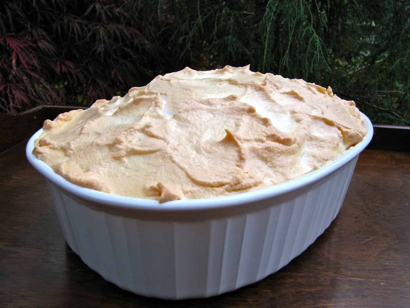 A layer of golden meringue tops a baking dish filled with Alvine's Bread Pudding.