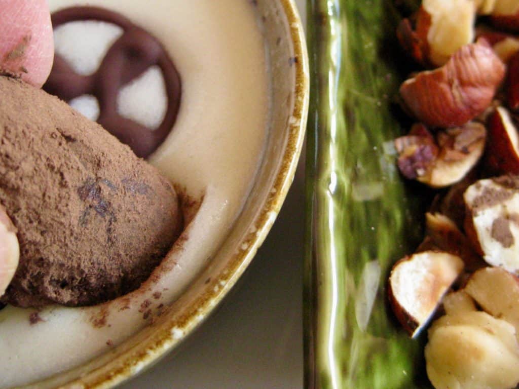 Chocolate Ganache rolled in cocoa powder before being plunged into White Chocolate Dipping Sauce and toasted hazelnuts.