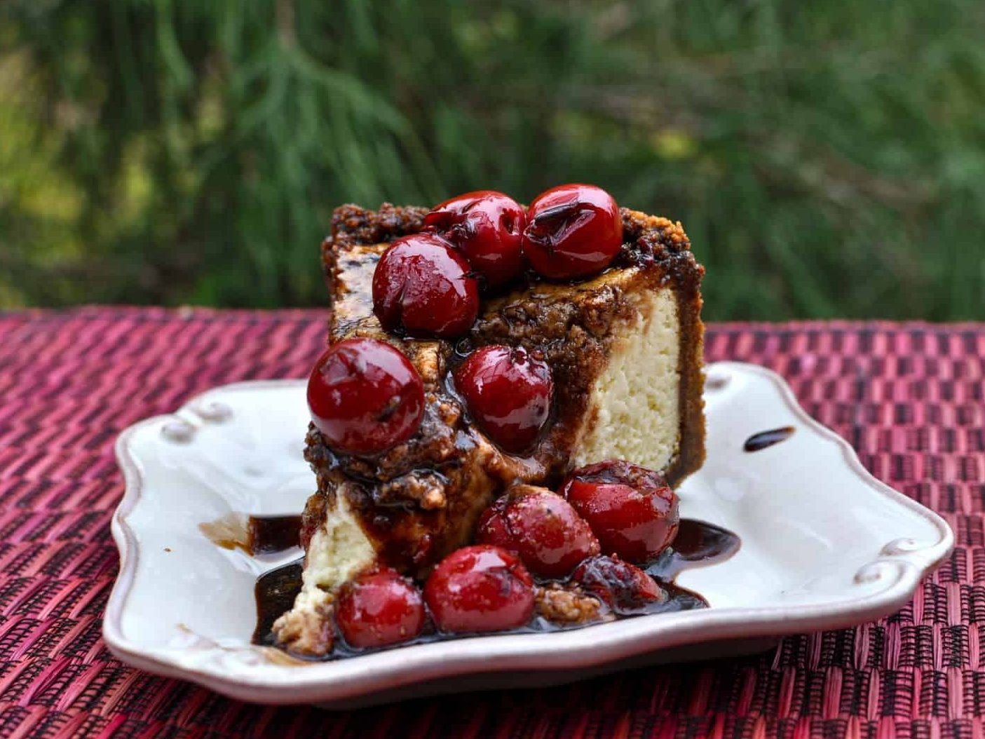 Honeyed Balsamic Cherry Cheesecake in a Triple Ginger Crust