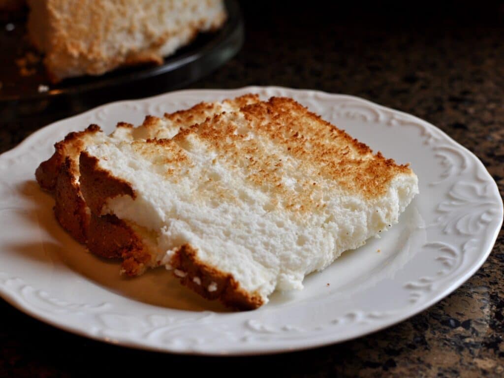 A thin slice of High Rise Angel Food Cake toasted and served on a plate. 