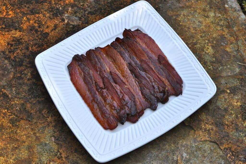 Strips of Candied Bourbon Bacon before it is cut into Bites.