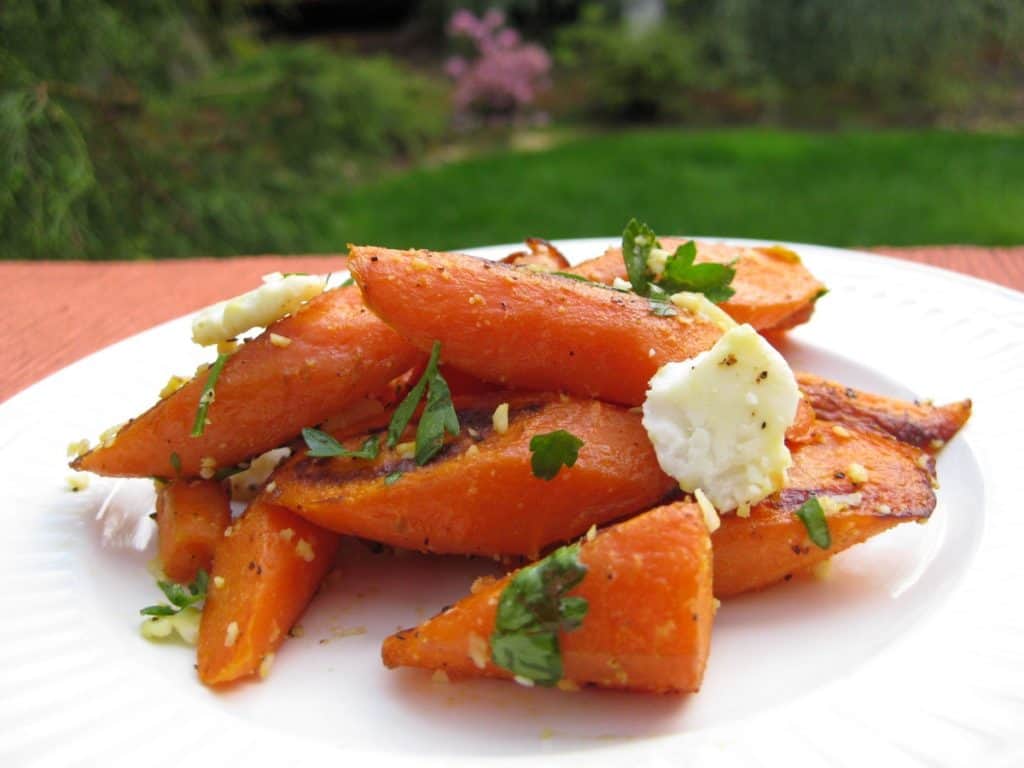 A serving of Roasted Carrots with Feta and Thyme on a plate.