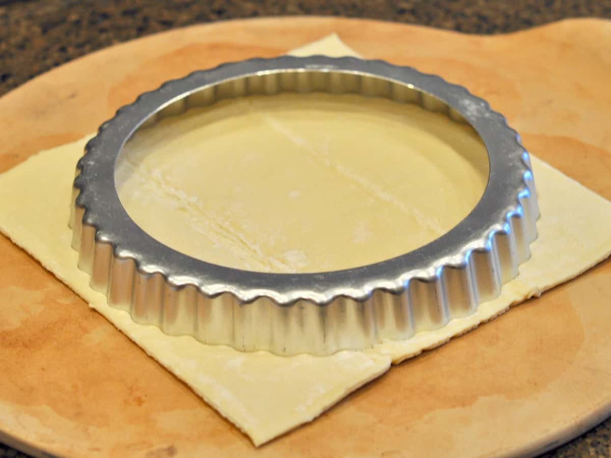 A tart pan can be used to cut a circle of puff pastry for a Galette des Rois, or King's Cake.