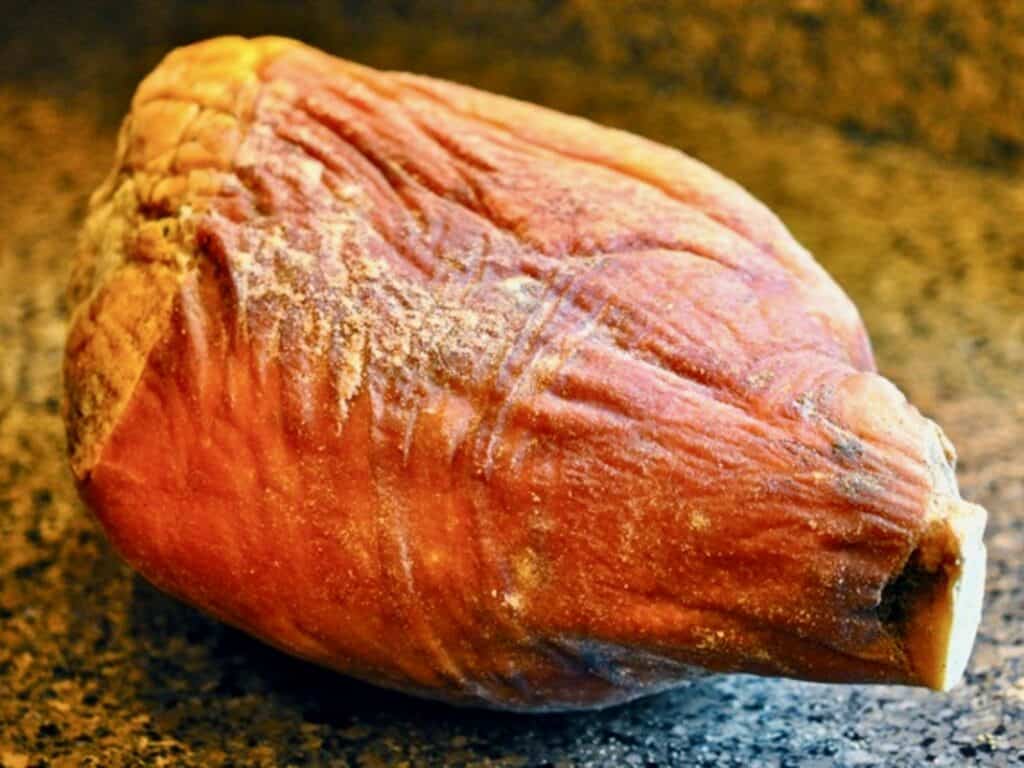 An unwrapped Country Ham.