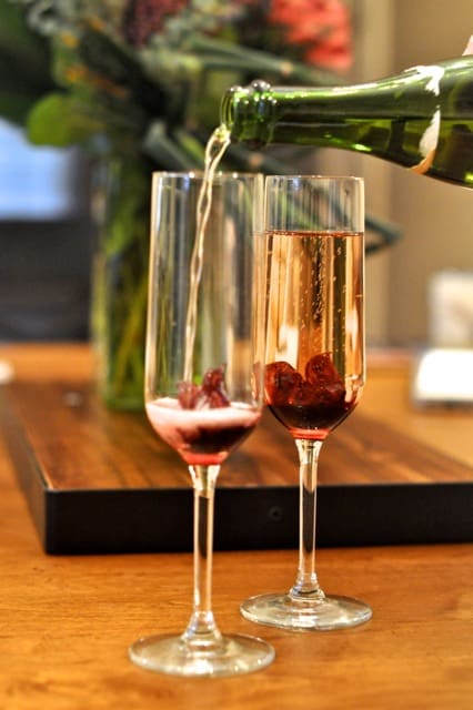 Wild Hibiscus Flowers are placed in flutes before filling with champagne to make a beautiful champagne cocktail. 