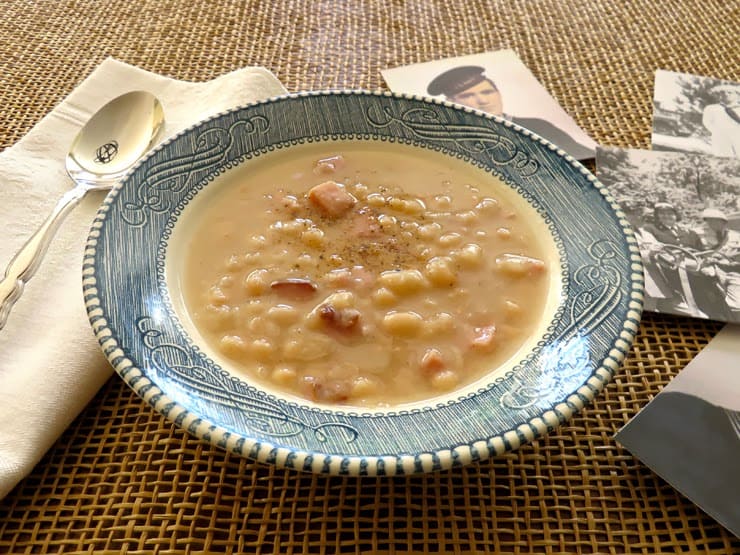 A bowl of Navy Bean Soup served in Mom's Courier and Ives Ironstone bowl.
