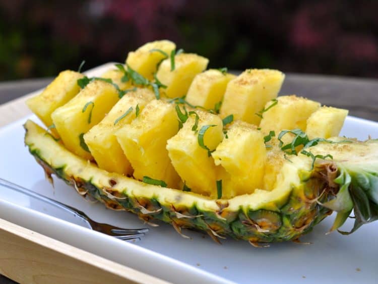 Party Pineapple cut into pieces and served in the pineapple shell.