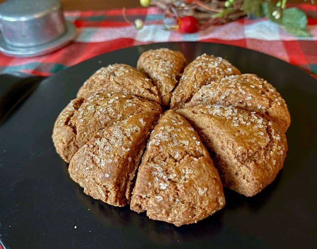 A wheel of Gingerbread Scones sprinkled with coarse sugar.