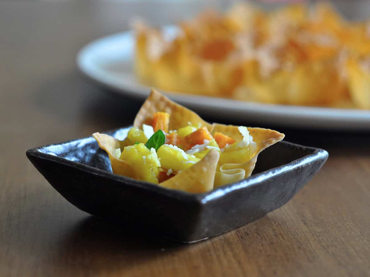 Pineapple Sweet Potato Salsa in Wonton Cup on small Japanese Plate.