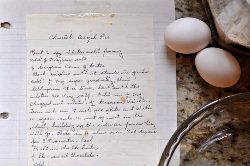 Handwritten recipe for Aunt Hen's Chocolate Angel Pie with eggs and pie plate. 