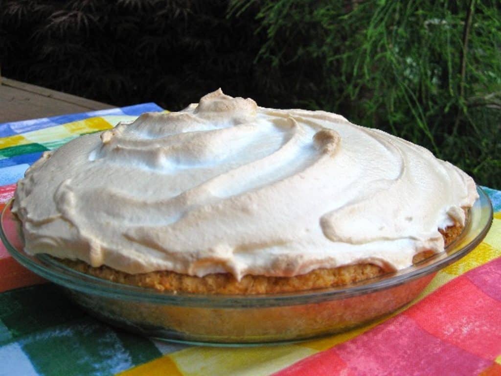 Lemon Meringue Pie with Meringue That Won't Weep on a bright tablecloth.
