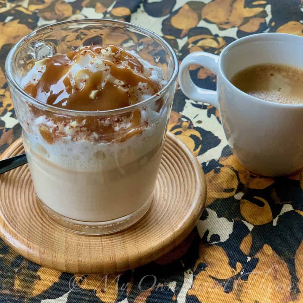 Peanut Butter Fudge Steamer in glass cup with a shot of espresso on the side.