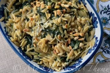 Orzo with Spinach and Pine Nuts in a pretty dish from Louisville Stoneware