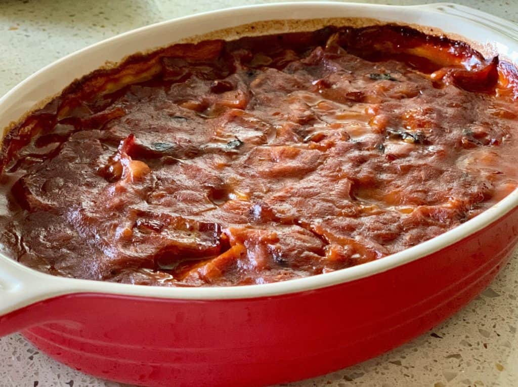 Bourbon Baked Beans with Bacon Baked in a Casserole Dish