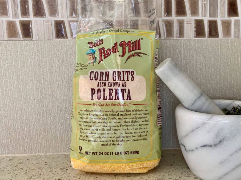 Bob's Red Mill Corn Grits in bag on a kitchen counter