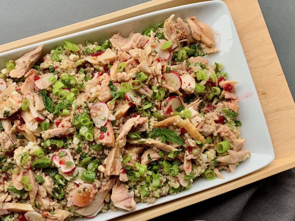 Radishes, sugar snap peas and fresh mint mixed with quinoa and rotisserie chicken are make a delicious main dish Spring Garden Salad.