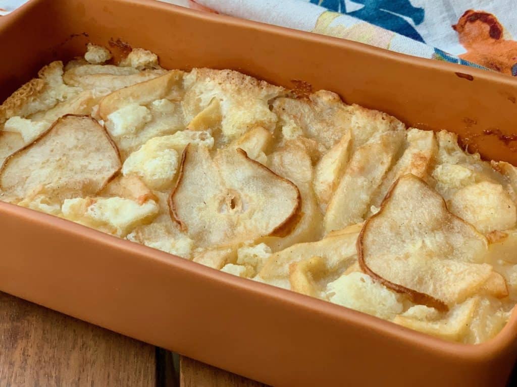 Mama Jean's Great Cobbler baked with Pears in a pumpkin colored baking dish.
