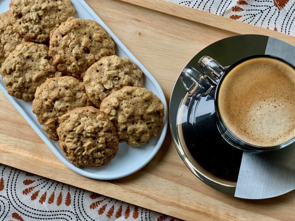 Aunt Betty's Spicy Oatmeal Cookies served on a tray with coffee.
