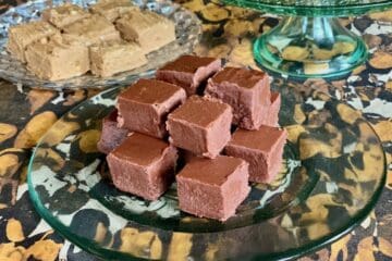 A plate of Aunt Noni's Christmas Fudge on display in front of Aunt Hen's Peanut Butter Fudge and Mama Jean's Old Fashioned Fudge.