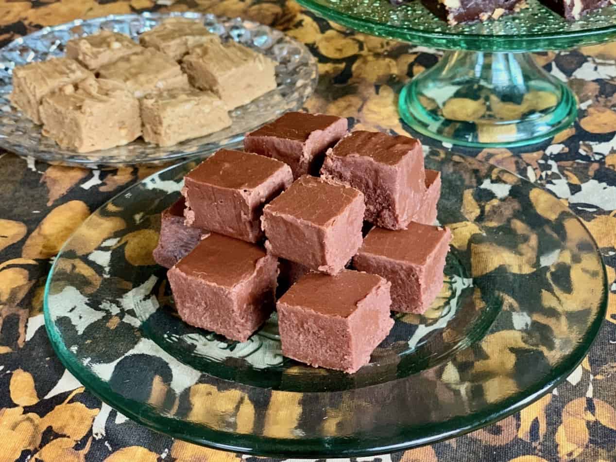 A plate of Aunt Noni's Christmas Fudge on display in front of Aunt Hen's Peanut Butter Fudge and Mama Jean's Old Fashioned Fudge.