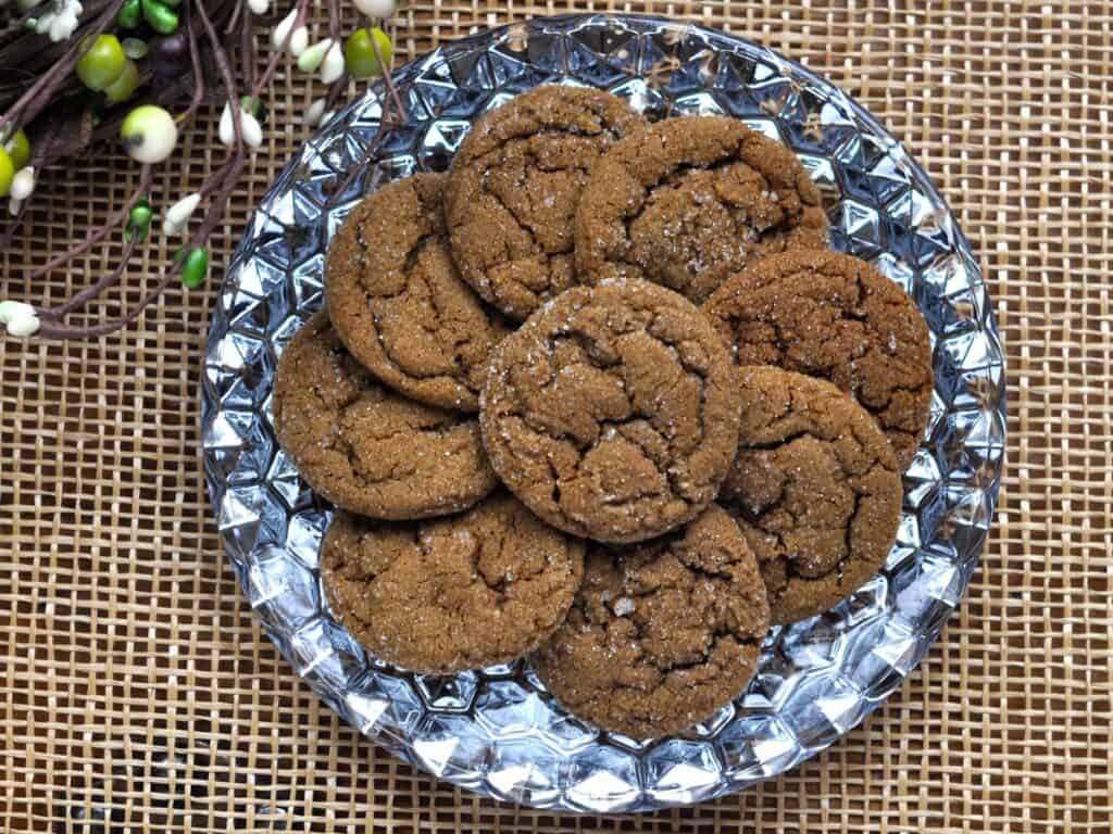 Spicy Molasses Crinkles are arranged on a shiny serving plate.