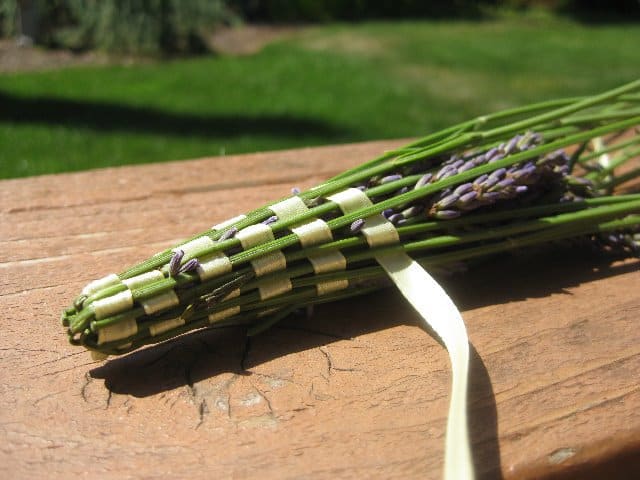 Weaving a lavender wand.