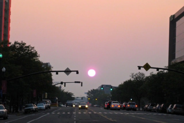 The sun through a haze of smoke seen from the streets of Salt Lake City in the autumn of 2012.